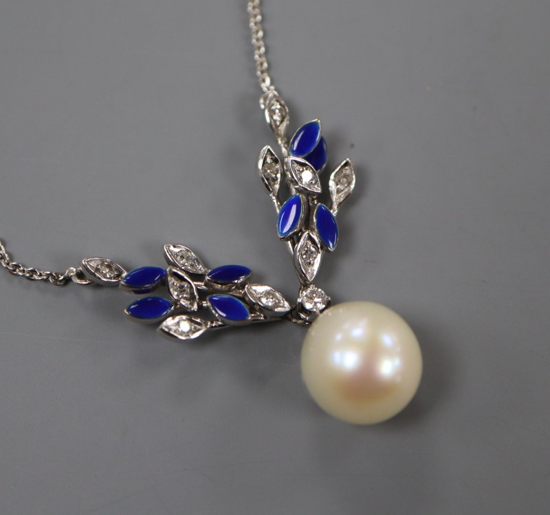 A modern white metal, cultured pearl, diamond and blue enamel set drop pendant necklace, pendant 31mm, chain 37cm, gross 6.3 grams.
